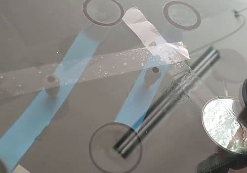 Glass Ding provides glass inspection services while operating machinery.