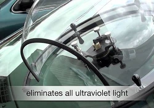 A car with a windshield and a steering is serviced by Glass Ding as part of mobile windshield repair.